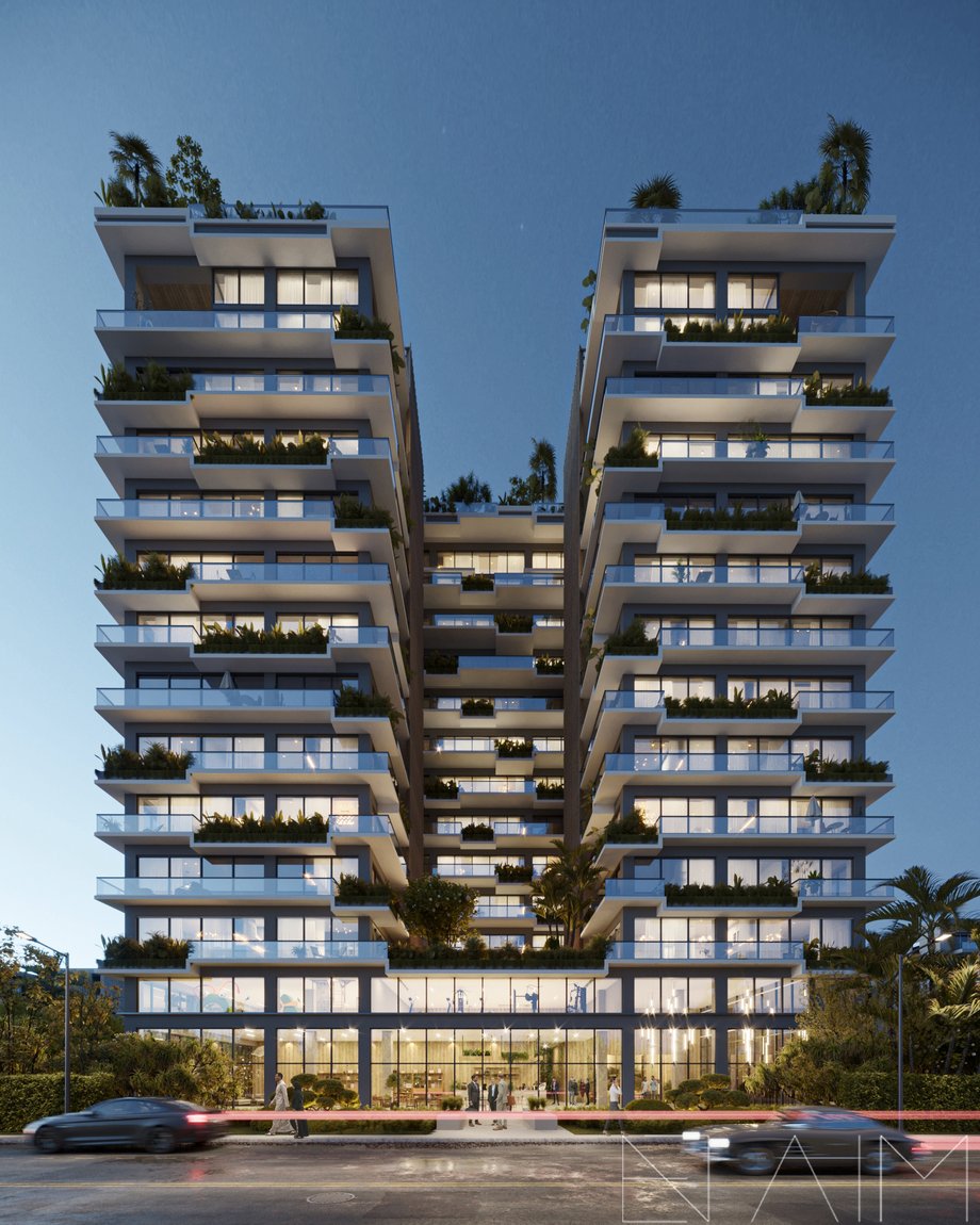   Modern high-rise apartment building with illuminated windows and greenery on terraces at night.