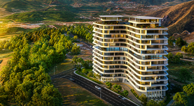 Luxury residential apartment tower surrounded by greenery and hills in Islamabad during golden hour
