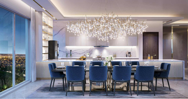 Luxury open-plan dining and kitchen area at One Serene Residences featuring premium finishes, designer lighting, contemporary cabinetry and panoramic city views.