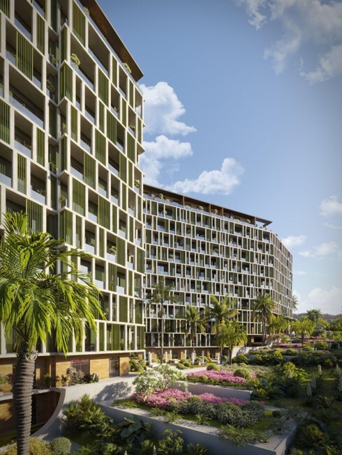 A modern building against a layered outdoor landscape with foliage
