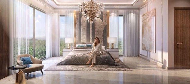 A luxurious bedroom with a hanging modern light fixture, tall windows and panelled walls