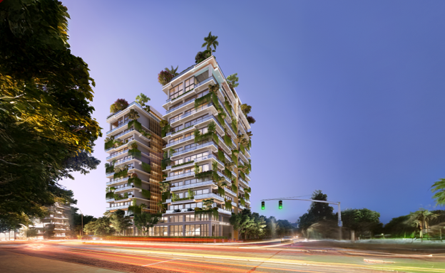 Evening street view of One Canal Road, a property in Lahore, featuring illuminated luxury residential towers and landscaped surroundings