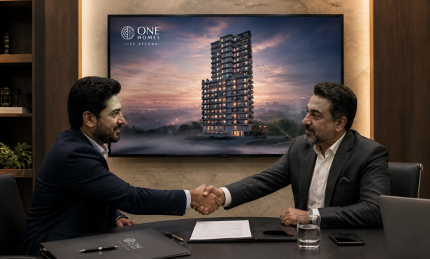 An image of two Pakistani men in suits shaking hands with a screen showing a building by One Homes in the background