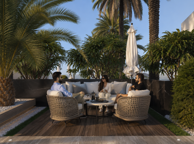 Residents enjoying the landscaped rooftop lounge, featuring premium seating, lush greenery, and luxury community spaces.