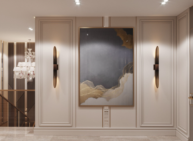 A bedroom in neutral shades of cool grey with hanging light fixtures in gold with crystals