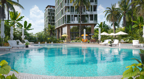 A large pool surrounded by foliage sprawls out in front of a residential apartment building