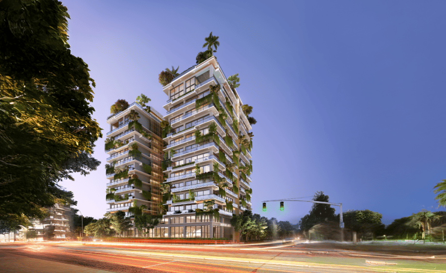 Evening street view of One Canal Road, a property in Lahore, featuring illuminated luxury residential towers and landscaped surroundings