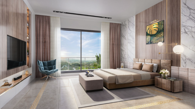 A large bedroom with a double bed, TV, chair, and ottoman, as well as modern light fixtures, flooring and wall panels, showcases high-end living