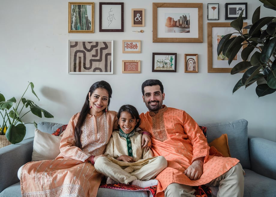 Pakistani family sharing a joyful moment at home, reflecting the emotional connection to Pakistan and how secure property investment in Pakistan offers peace of mind, stability, and a sense of belonging abroad.